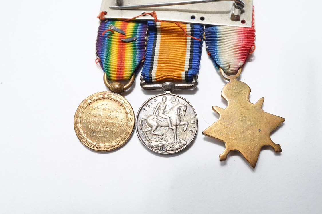 A First World War Mons Star trio awarded to Capt. A.D. Lowdell, with a clasp for 5th Aug-22nd Nov 1914, and oakleaf - mention in dispatches, together with the miniature set, plus a WWII Defence medal in its original card